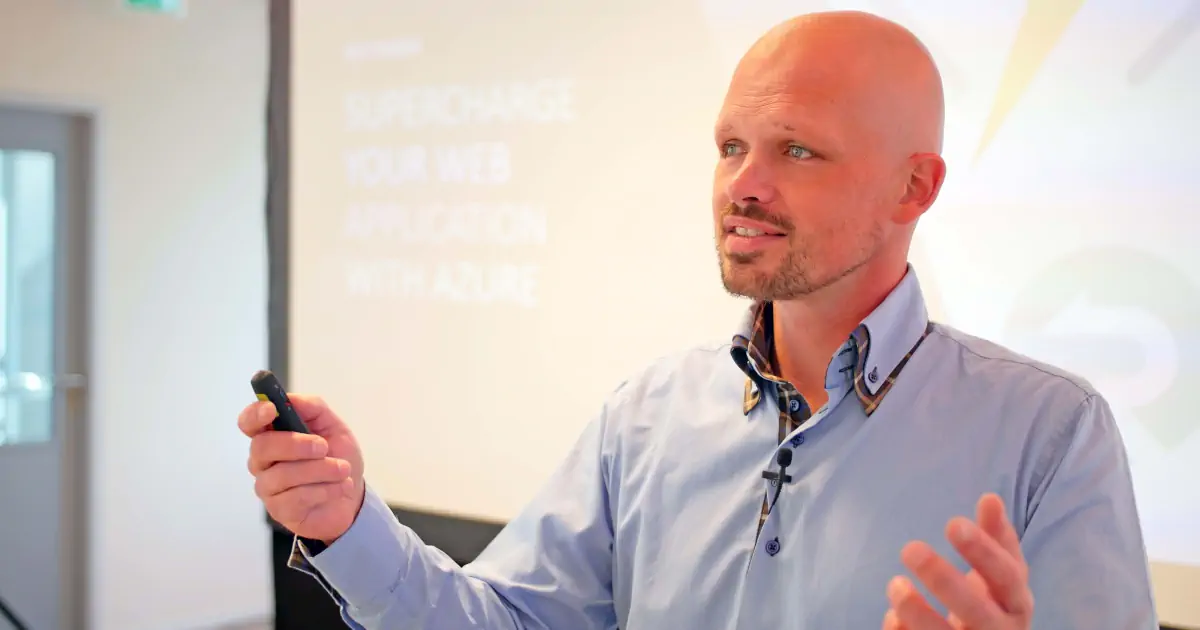 Rick van den Bosch speaking at a technical event